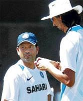 Gearing up: Sachin Tendulkar and Ishant Sharma chat during a practice session at Chandigarh on Monday. AP