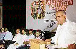 Coastal Development Authority Chairman B Nagaraj Shetty addressing a gathering at the World Tourism Day celebrations in Mangalore on Monday. Deputy Commissioner V Ponnuraj, MLA N Yogish Bhat and others look on. DH Photo