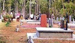 Yaluvahalli youths of Chikkaballapur taluk cleaning the region around the burial ground. DH photo