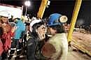 Freedom At Midnight: Chilean miner Osman Araya is welcomed by his wife Angelica as he comes out of the Phoenix capsule after being brought to the surface on Wednesday following a 10-week ordeal in the collapsed San Jose mine, near Copiapo, north of Santiago, Chile. AFP
