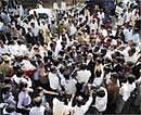Quote hangers: Mediapersons swarm political leaders and advocates for soundbites outside the High Court in Bangalore on Monday. DH Photo