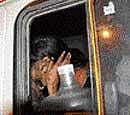 Nirasha (17), Kumars acquaintance, in a police van outside the D J Halli police station, Bangalore, on Tuesday. DH Photo