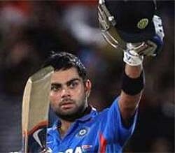 Indian cricketer Virat Kohli celebrates his century during the 2nd ODI against Australia at Dr. Y S Rajasekhara Reddy Stadium in Vishakhapatnam on Wednesday. PTI