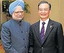 Prime Minister Manmohan Singh and his China counterpart Wen Jiabao seen at a meeting in Thailand last year. The two leaders are scheduled to meet in Hanoi on Friday. AFP/ File Photo