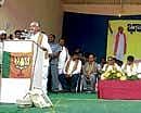 Chief Minister B S Yeddyurappa addresses BJP activists meeting at the Nandi Rangamandira of Junior College in Chikkaballapur on Sunday. dh photo
