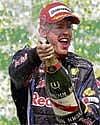 Champagne Moment Red Bulls Sebastian Vettel savours his victory at the Brazilian Grand Prix on Sunday. AP