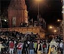 People gather at the site of an explosion that rocked the Dashashwamedh ghat on the bank of the river Ganga river in Varanasi on Tuesday evening. PTI