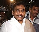 Former Telecom Minister A Raja talks to mediapersons as he arrives at the New Delhi airport on Wednesday. PTI