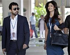 Bollywood actress and co-owner Rajasthan Royals team Shilpa Shetty, right, arrives with her husband Raj Kundra for the Indian Premier League (IPL) player auction in Bangalore, India, Saturday, Jan. 8, 2011. AP