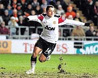 Timely Strike: Manchester United's Javier Hernandez celebrates after scoring the team's second goal against Blackpool at Bloomfield Road on Tuesday. Reuters