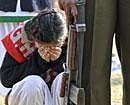 A Kashmiri woman covers her face during a Republic Day parade held at Bakshi Stadium in Srinagar on January 26, 2011. India celebrated its 62nd Republic Day under heavy security, with tensions running high in Kashmir over efforts by Hindu nationalists to hold a rally in the troubled region's state capital. AFP