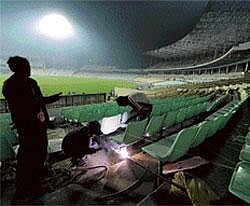 Unfinished Job: Workers weld seat holders on a part of the stand under construction at the Eden Gardens stadium in Kolkata on Thursday. AFP