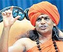 Nithyananda addresses a press conference at his Bidadi ashram on Tuesday. DH Photo