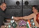Foreign Secretary,Nirupama Rao(R) shakes hand with her Pakistani Counterpart Salman Bashir during a meeting in Thimphu,Bhutan on Sunday.PTI