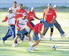 Indian cricketers enjoy a game of football during a training session at the Chinnaswamy Stadium on Wednesday. DH Photo/ Srikanta Sharma R