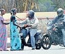 Pestering: Two-wheeler riders are worst affected by eunuchs. DH Photo by Shivakumar B H