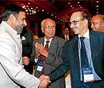 Commerce & Industry Minister Anand Sharma greets industrialist Adi Godrej as Hero Group Chairman Brijmohan Lall Munjal looks on at the CII National Conference and Annual Session 2011 in New Delhi on Friday. PTI