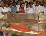 Sathya Sai Baba lying in an air-conditioned glass casket- AP photo