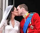 Prince William and his wife Kate, Duchess of Cambridge, kiss on the balcony of Buckingham Palace in London, following their wedding at Westminster Abbey on Friday. AP