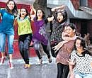 Students celebrate their success in the  CBSE class XII examinations, in a New Delhi school on Monday. PTI
