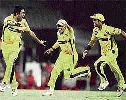 Big Scalp: Super Kings R Ashwin (left), S Badrinath (centre) and Suresh Raina celebrate the dismissal of Royal Challengers Chris Gayle in IPL IV final in Chennai on Saturday. AP