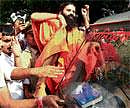 Back in action: Baba Ramdev with his supporters after addressing the media during his visit to New Delhi on Sunday. PTI