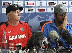 India coach Duncan Fletcher, left, and MS Dhoni answer a question during a news conference in Taunton, England, Thursday July 14, 2011. India will play their first match in their tour of England against Somerset starting Friday. AP