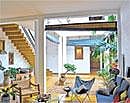 Wide, Open Spaces Dipika Dharmadasas home has multiple courtyards and many green spaces. n spaces. This picture shows the  guest room.  Photo by Varna Shashidhar