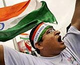 A supporter of rights activist Anna Hazare shout slogans after Hazare was detained prior to beginning a hunger strike in New Delhi, on Tuesday. AP