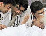 A team of doctors checks the health of India's anti-corruption activist Anna Hazare on the stage during his hunger strike in New Delhi. AP Photo