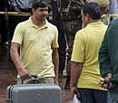 Members of an investigating team with collected materials from the blast site outside the Delhi High Court in New Delhi on Wednesday . PTI