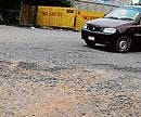deplorable state: A bad and unmotorable stretch of a road in HSR Layout.. DH Photo