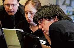 (L-R) Aspiritech employees Rick Alexander, Katie Levin and Jamie Specht work at the nonprofit firm that specialises in finding software bugs in Highland Park, Illinois, United States. AP