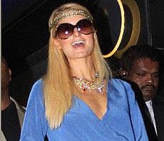 American businesswoman, socialite, model and fashion designer, Paris Hilton smiles on her arrival at the Mumbai International Airport on Saturday early morning. PTI