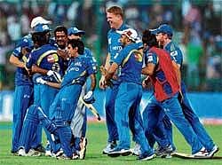 Team Work :Mumbai Indians celebrate their one-wicket win over Trinidad & Tobago in the Champions League on Monday. DH photo/ Srikanta Sharma R