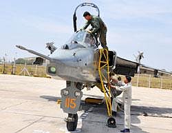 Prep school: An ASTE Test Pilot enters a Jaguar aircraft before a routine sortie.