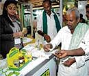 Trial: Farmers try organic food at a German stall set up at India Organic 2011- International Competence Centre for Organic Agriculture - organised by the Department of Agriculture at Palace Grounds in Bangalore on Thursday. DH Photo