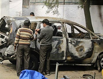 Two people could have been involved in executing the blast on the Israeli embassy car, one to plant the bomb and the other to trigger it, sources involved in the investigation said Tuesday while admitting that they still have no clue about the explosives used.AP Photo