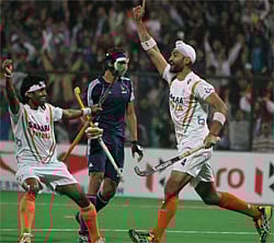 India's Sandeep Singh(R) celebrate with Shivendra Singh after 2nd goal against France during the Olympic qualifier (men) hockey match final in New Delhi on Sunday. PTI Photo