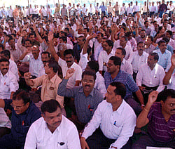 PU College Lecturers who boycotted evaluation of  second PU papers stage a dharna at Freedom park in Bangalore on Monday to press their demands. --KPN