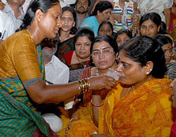 MLA Vijayalakshmi break her fast while staging a protest along with family members and supporters against the arrest of her son and YS Congress chief Jagan Mohan Reddy, in Hyderabad. PTI