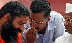 New Delhi: Yoga guru Baba Ramdev, Anna Hazare and team Anna member Arvind Kejriwal, during the day long fast called by Ramdev in New Delhi on Sunday. PTI Photo by Vijay Verma