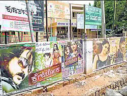 Government hospital compound dotted with cinema posters in Chamarajanagar. dh photo