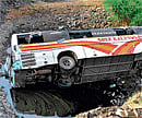 TRAGIC END: The ill-fated private passenger bus that fell off a river bridge near Osmanabad town on Saturday. PTI