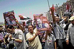 Shortlived celebrations: Supporters of Mohammed Morsi, of the Muslim Brotherhood's political party, celebrate in Cairo's Tahrir Square on Tuesday. NYT