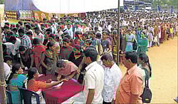 Aspirants register their names at the job mela in Mandya on Saturday. dh photo