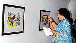 Thats FUnny A visitor has a good laugh at a Mario Miranda caricature, currently part of an exhibition in the City.