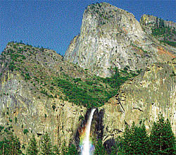 bathed in sunlight Waterfall at Yosemite National Park, USA.