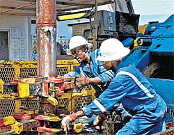 Black gold: Tullow Oil drillers in Uganda, where a 1.1-billion-barrel oil field was discovered in 2006, in an undated handout photo. Since 2006, Tullow Oil has made major discoveries in Kenya, Uganda and off the coasts of Ghana and French Guiana by focusing on geologically similar regions in Africa and Latin America. NYT