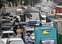 Gridlock: Traffic came to a standstill on JC Road during the protest by Vokkaligas against BJPs decision to remove Sadananda Gowda from the chief ministers post. dh photo
